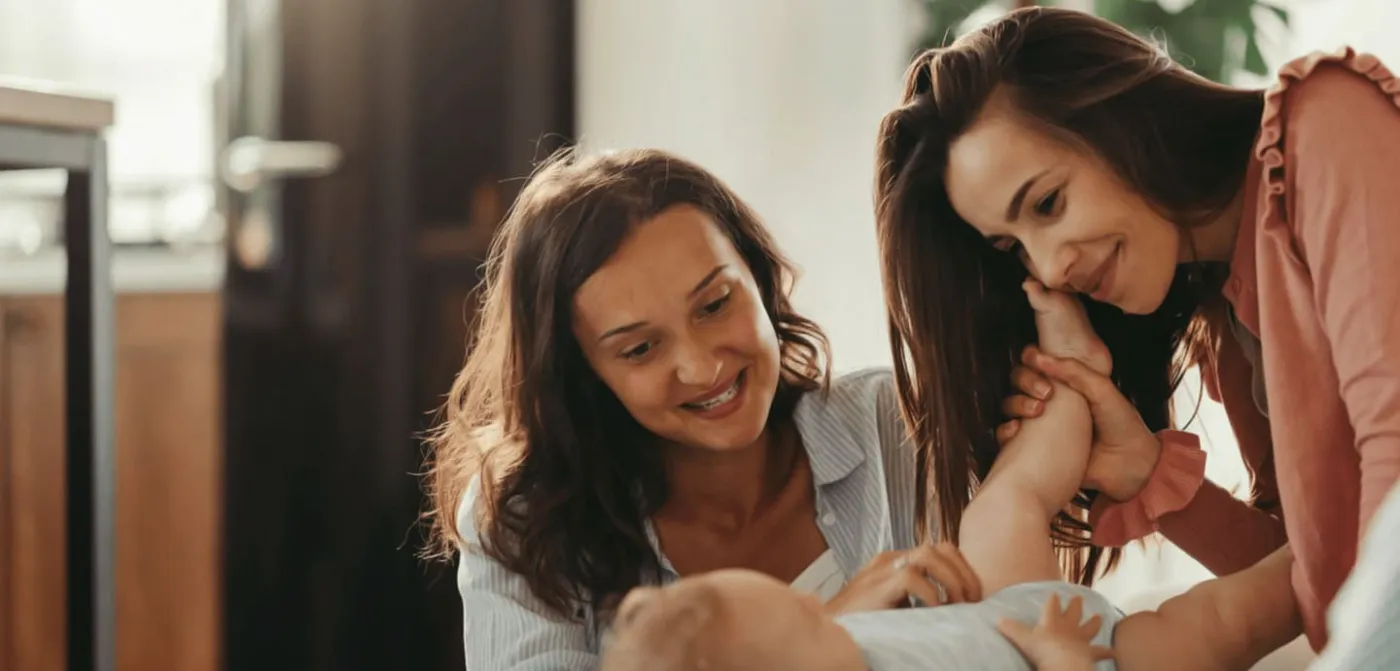 Shady Grove Fertility homepage image of two mothers with a baby