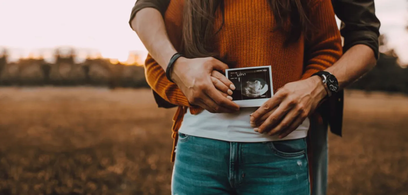 Shady Grove Fertility homepage image of prospective parents holding an ultrasound